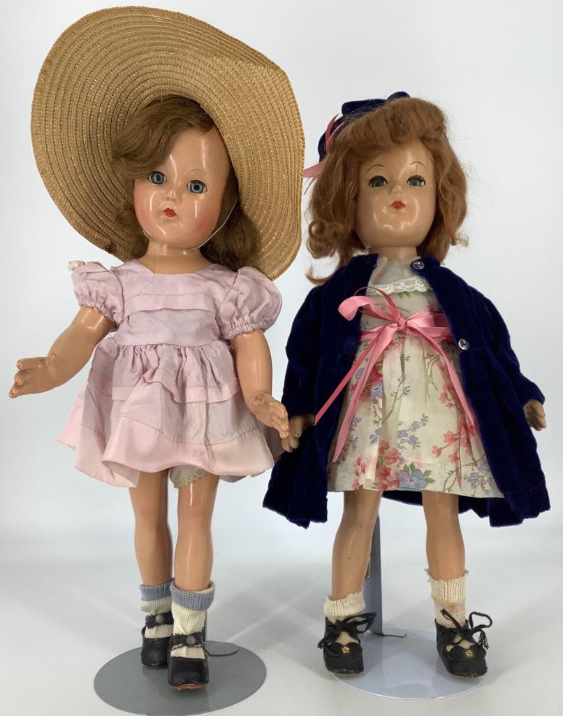 (2) 15" vintage Effanbee composition Anne-Shirley dolls: (2) 15" vintage Effanbee composition Anne-Shirley dolls including one with mohair wig wearing floral dress and blue coat and hat and other with human hair wig wearing pink dress. Doll with mohair wig