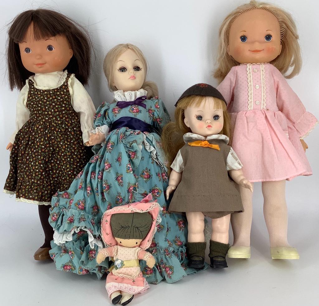 Lot (4) vinyl dolls. Includes 11" Effanbee Brownie, 15": Lot (4) vinyl dolls. Includes 11" Effanbee Brownie, 15" Effanbee lady in floral print, and two Fisher Price play dolls. These dolls are being sold AS IS.