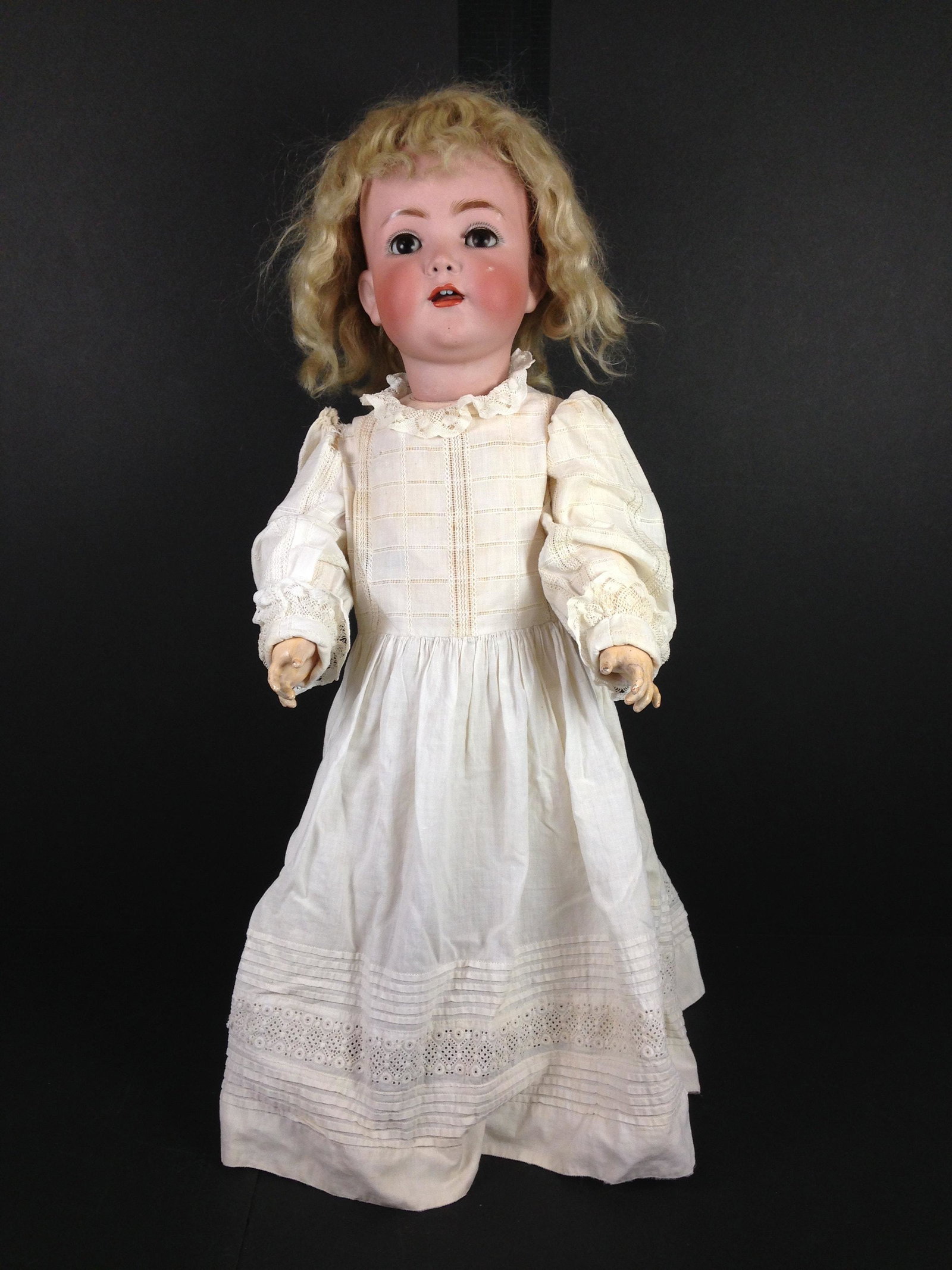 22" FRANZ SCHMIDT 1295 BISQUE SOCKET HEAD CHARACTER: 22" FRANZ SCHMIDT 1295 BISQUE SOCKET HEAD CHARACTER TODDLER. MOHAIR WIG, GLASS SLEEP EYES WITH LASHES, PIERCED NOSTRILS AND OPEN MOUTH WITH TEETH AND WOBBLE TONGUE. ON FULLY JOINTED COMPOSITION AND WO