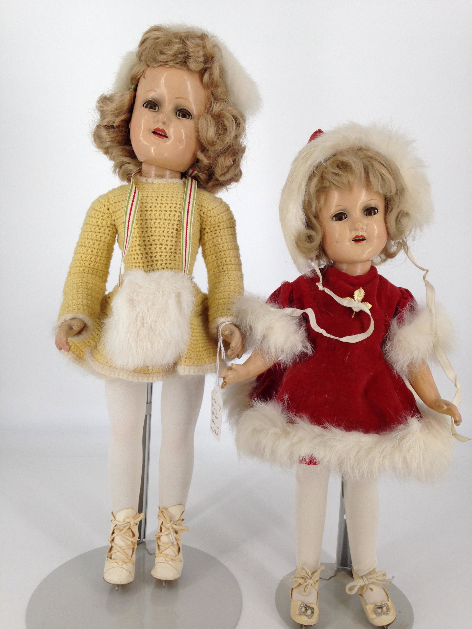 (2) MADAME ALEXANDER COMPOSITION SONJA HENIE DOLLS.: (2) MADAME ALEXANDER COMPOSITION SONJA HENIE DOLLS. INCLUDES 14" WITH MOHAIR WIG, SLEEP EYES, OPEN MOUTH WITH TEETH, ON FIVE-PIECE COMPOSITION BODY, DRESSED IN RED VELVET SKATING OUTFIT TRIMMED IN RAB