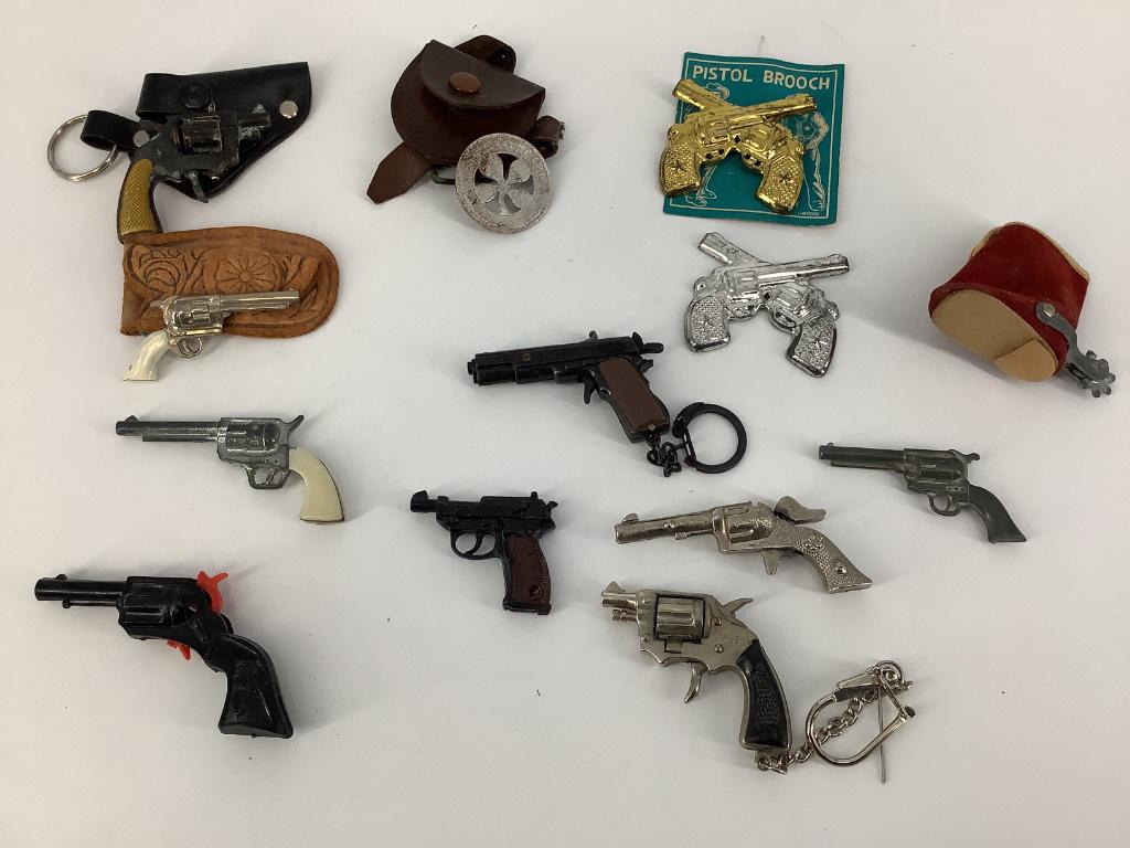 Box lot miniature metal toy guns.: Box lot miniature metal toy guns.