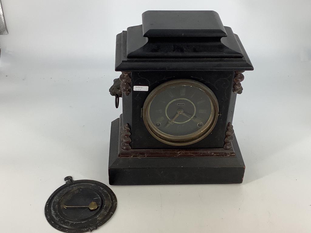 Turn of the century black mantle clock. (1 of 1)