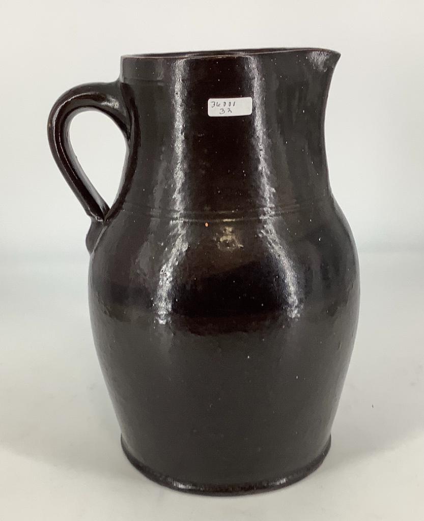Brown stoneware pitcher 11â€. (1 of 1)