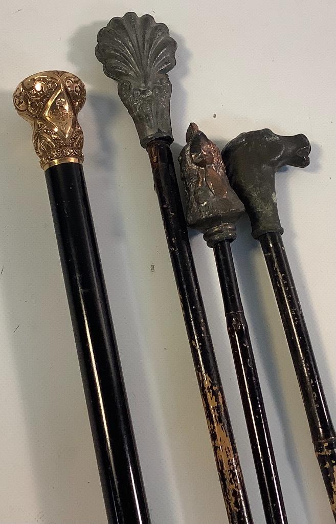 Lot of 4 walking canes. Including one with gold filled (1 of 2)