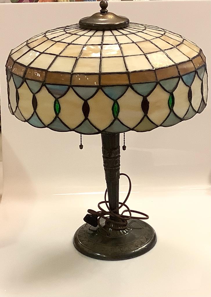 Tiffany style leaded glass table lamp with metal base.: Tiffany style leaded glass table lamp with metal base. 16” Diameter 21 inches tall.