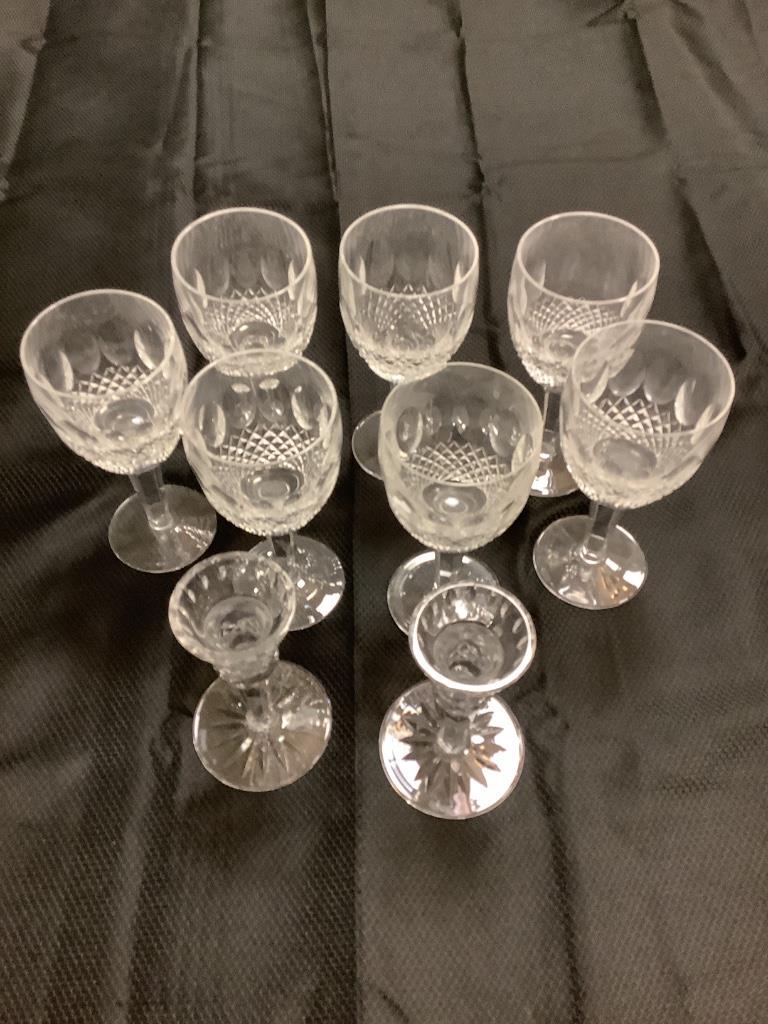 Set of seven Waterford wine glasses and two: Set of seven Waterford wine glasses and two candlesticks.