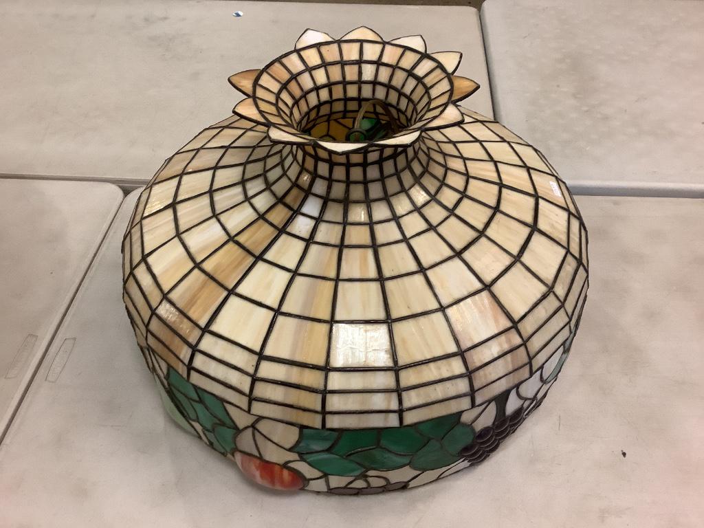Leaded slag glass ceiling dome light with blown out: Leaded slag glass ceiling dome light with blown out fruit motif, 22” diameter. One piece at crown needs resoldered.