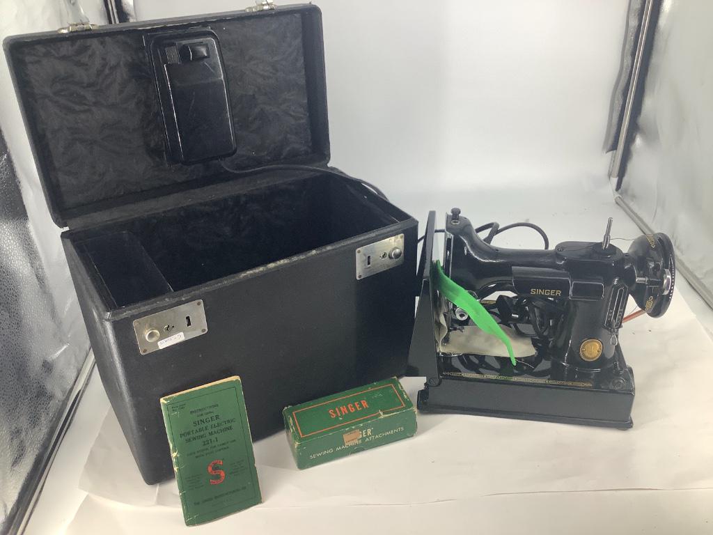 Singer featherweight sewing machine in black case,: Singer featherweight sewing machine in black case, serial #al161712 bobbin case in office