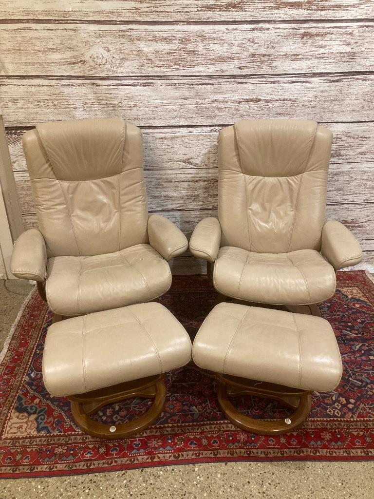 Pair of Palliser leather swivel recliners with: Pair of Palliser leather swivel recliners with ottomans. Some leather has scratches and scuffs. Scratches on wood of one ottoman as well. 33“ x 41“