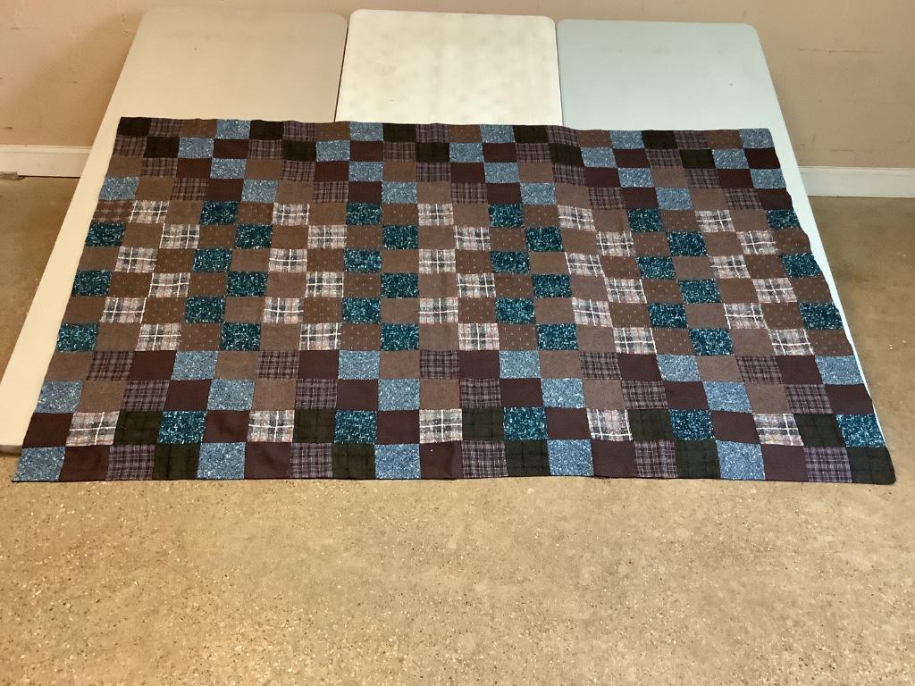 Wool checkerboard quilt. 50" x 84" in size. Dark (1 of 2)