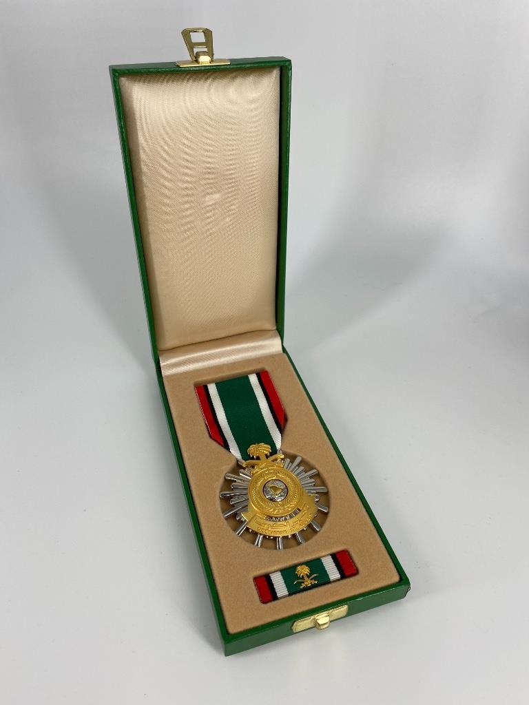 Desert Storm Medal: Desert Storm Medal Kingdom of Saudi Arabia "Liberation of Kuwait" medal. Circa 1991. Includes service ribbon with device. In original box. Like new condition. Silver star with fifteen rounded points o