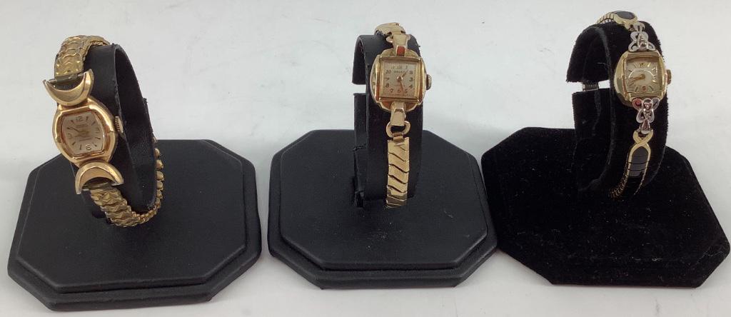 Three Vintage Ladies' Wrist Watches: Three Vintage Ladies' Wrist Watches Longines with 10kt yellow gold case (engraved BM) with worn off-white face and gold tone hands/indicators (winds, sets and ticks at time of listing) case back 1.3 g