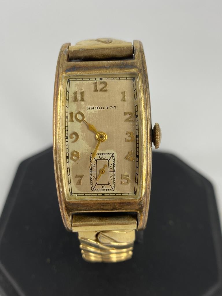 Vintage Hamilton Wrist Watch: Vintage Hamilton Wrist Watch Winds, sets and ticks at time of listing. Gold filled case and caps (on Speidel stretch band). 27.5mm x 17.5mm face. Worn face. Case from Wadsworth numbered 070376. 17-jew