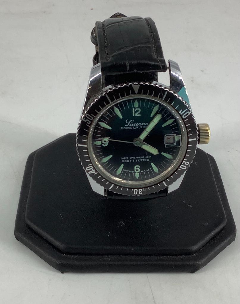 Lucerne Wrist Watch: Lucerne Wrist Watch Men's style, face measures 29.25mm in diameter, sets and runs at time of listing, swiss made automatic movement, gently used condition, black leather band, black face with glow in