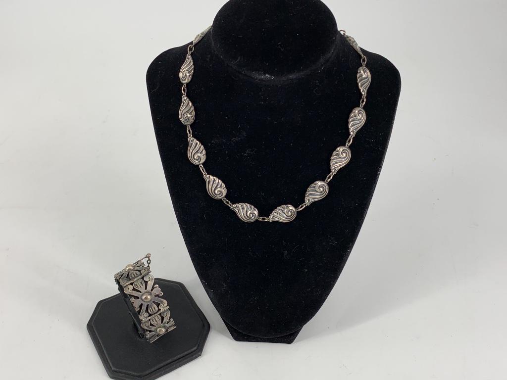 Two Vintage Sterling Silver Accessories: Two Vintage Sterling Silver Accessories 7.5" sterling silver bracelet with unusual clasp and metal beading. 16" choker length necklace with metal beads ft. wing motif (spring ring clasp) signed Danecr