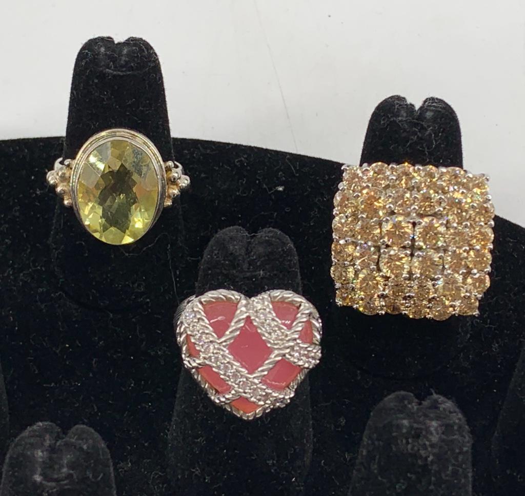 Three Sterling Silver Rings: Three Sterling Silver Rings Sizes 5.75 - 8.75. Stamped and/or tested 925, 1.205 troy ounces total weight. One heart shaped ring signed Judith Ripka. Including rose quartz and lemon quartz stones.