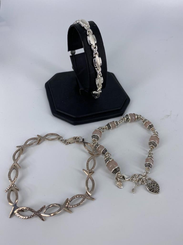 Sterling Sivler Accessories: Sterling Sivler Accessories Three sterling silver bracelets including 8.25” Ichthys bracelet with hammered and polished links, 8.25” modern sterling bracelet featuring oblong polished and
