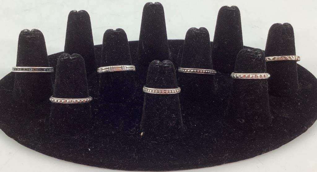 Seven Sterling Rings: Seven Sterling Rings Stamped and/or tested 925. 0.455 troy ounces total weight. Straight shank designs. Sizes 5.75 - 9.25. Some styles signed.