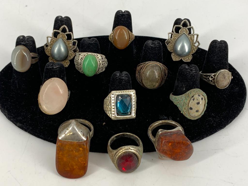 Lot of Assorted Fashion Rings: Lot of Assorted Fashion Rings Thirteen in total, silver and copper tone rings (base metal composition), sizes 6.5 - 10. Succinite, rose quartz, jasper, crystal, quartz and faux mabe pearl centers. Uns