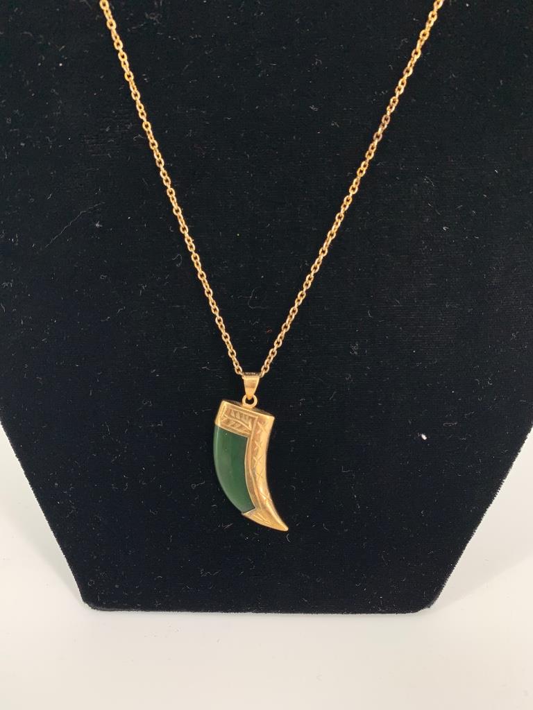 Jade Talon Pendant on Chain: Jade Talon Pendant on Chain 16" choker length gold tone metal chain necklace with spring ring clasp. Unknown maker. 1.125" polished green jade pendant with talon motif in gold tone metal mounting with