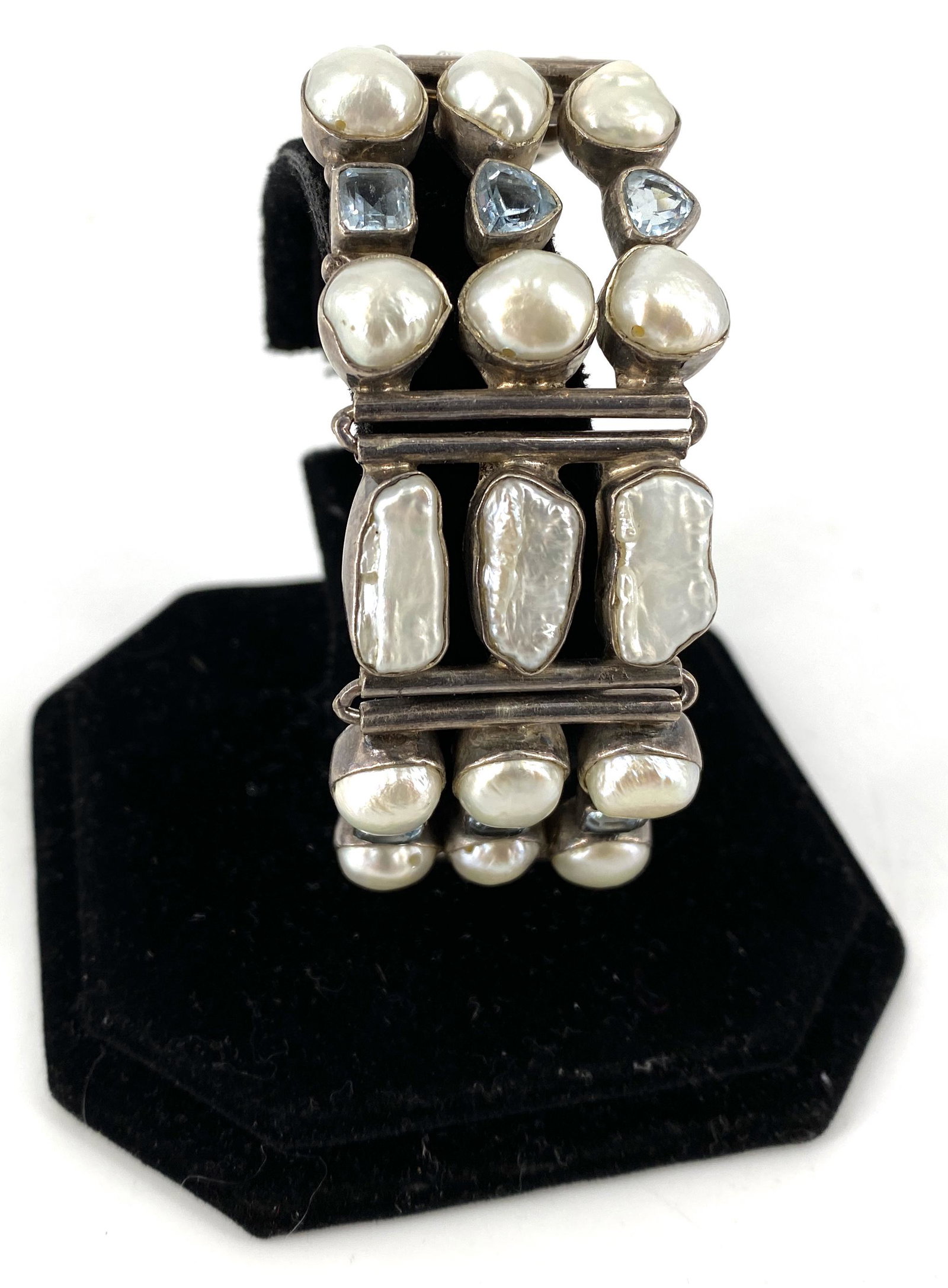 Sterling Silver Bracelet: Sterling Silver Bracelet Adjustable size, tests as sterling silver, 1.42 troy ounces total weight, toggle clasp closure, roundish and baroque shaped white pearls (cultured) measuring between 8mm and 1