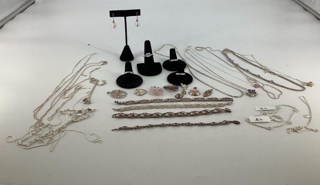 Sterling Silver Accessories: Sterling Silver Accessories Dozens of accessories including three straight shank rings all size 6.75, four bracelets featuring low kit gold overlay accents, 1.25” cross slide pendant with multi-