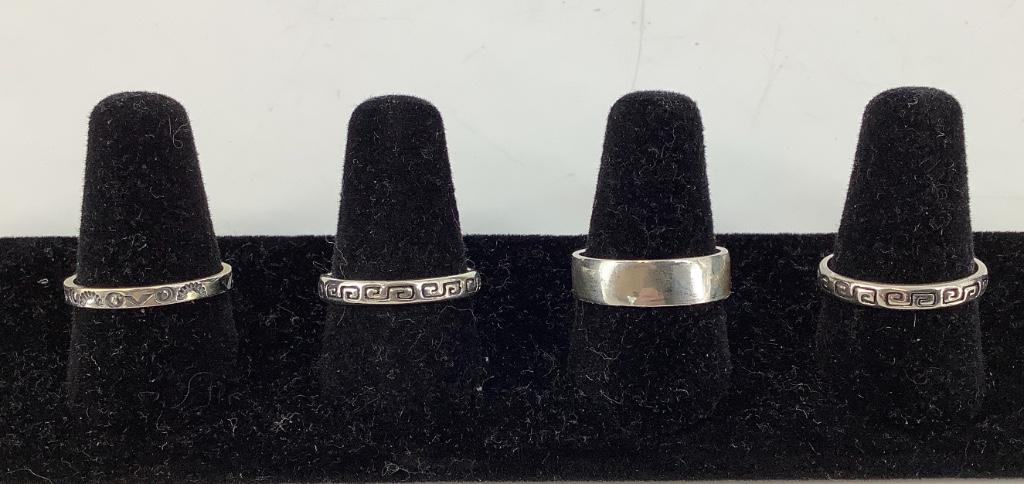 Sterling Silver Stackable Rings: Sterling Silver Stackable Rings Four in total, all size 8 with straight shanks including two with an embossed Greek Key design, one polished and one with an embossed Native American motif, all pieces