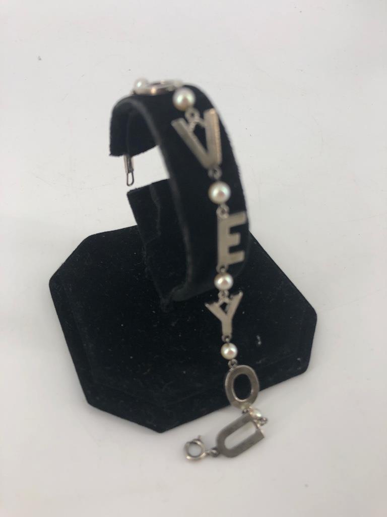 Sterling Silver Phonetic "Love You" Bracelet: Sterling Silver Phonetic "Love You" Bracelet Stamped and tested 950 silver, 0.295 troy ounces total weight, round 4.4mm pearl accent stones, spring ring clasp closure, 7" in total length, no signature