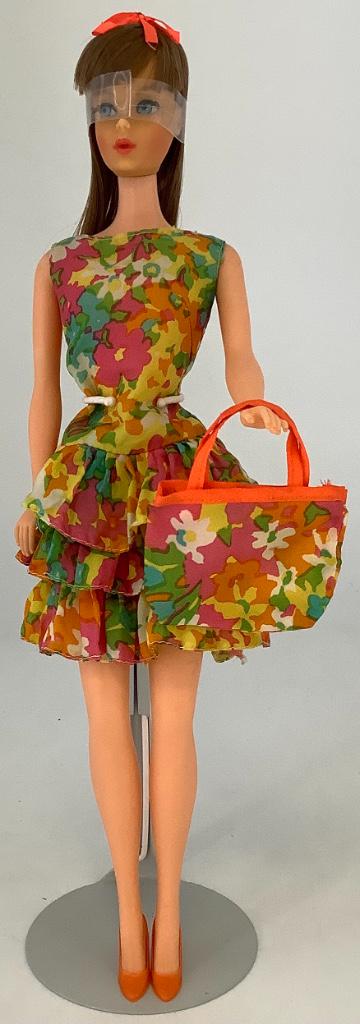 Brunette Twist & Turn Barbie. Doll wears #1805 "Bouncy: Brunette Twist & Turn Barbie. Doll wears #1805 "Bouncy Flouncy" dress, purse and shoes. Her hair is in original set with bow, nail and facial color good, retains most of her factory toenail polish, kn