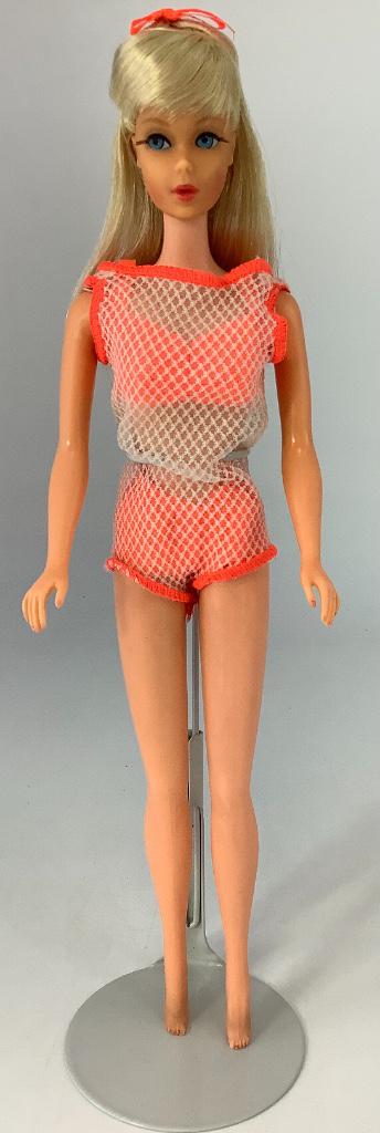 Platinum Twist & Turn Barbie. In unplayed-with: Platinum Twist & Turn Barbie. In unplayed-with condition, doll's hair is in original set, retains hair bow, original swimsuit, knee joints work well (3 clicks), retains some toenail polish.