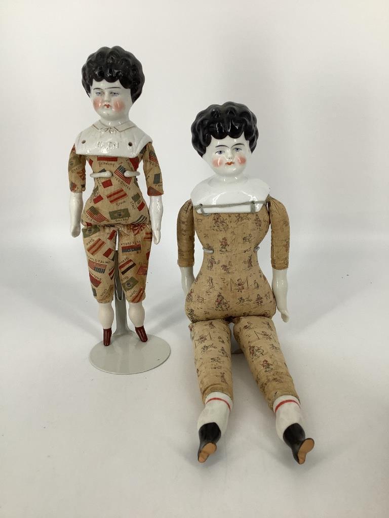 (2) China shoulder head ladies. Includes 11" pet name: (2) China shoulder head ladies. Includes 11" pet name "Helen" with flags of the world printed on her cloth body with china lower arms and legs. Her shoulderplate is marked "PATENT APP'L FOR/GERMANY". 