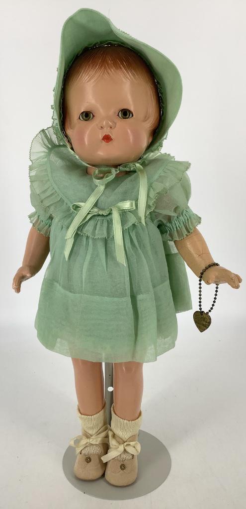 16" all composition Effanbee Patsy Joan redressed in: 16" all composition Effanbee Patsy Joan redressed in green organdy dress, undergarment and hat (copy of original). Molded and painted hair, sleep eyes with lashes and closed mouth; on five-piece body.