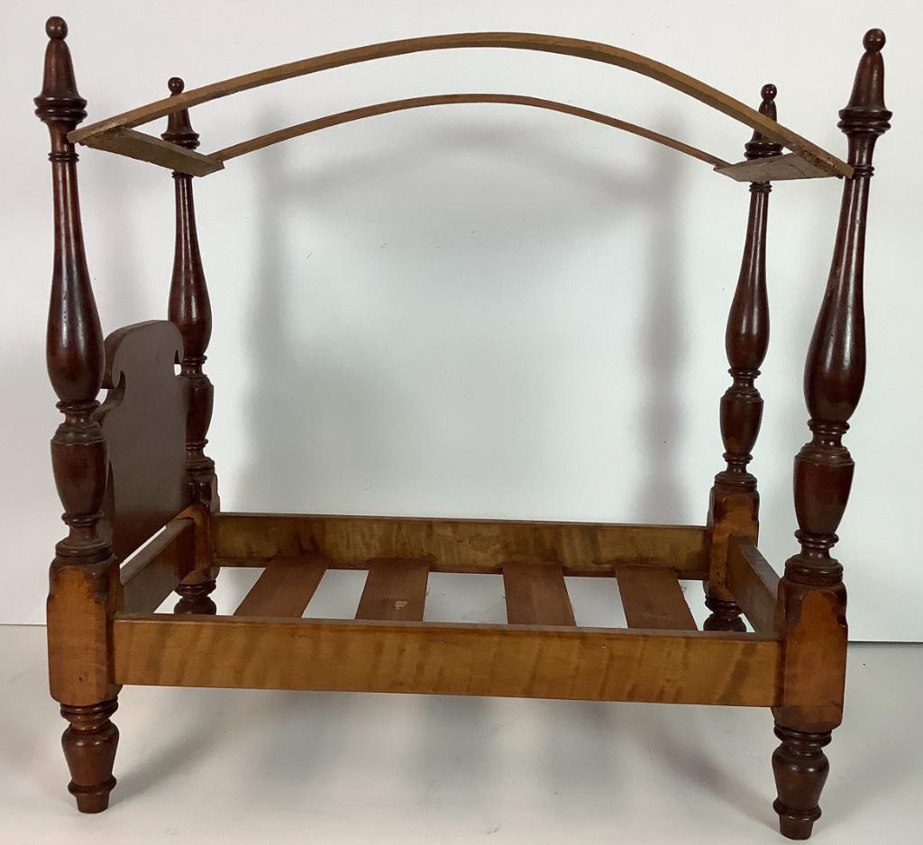 Antique four poster doll bed. Constructed of tiger (1 of 3)