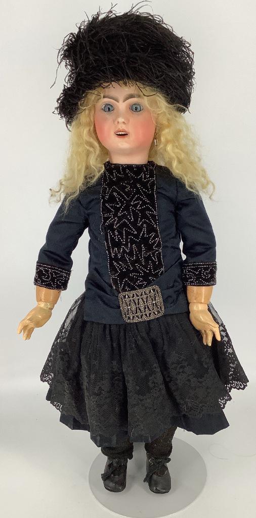 26" Jumeau bisque socket head doll. Replaced mohair: 26" Jumeau bisque socket head doll. Replaced mohair wig, stationary glass eyes, pierced ears, open mouth with square cut teeth, on jointed composition body. Head and body marked "11" as shown. Head ha