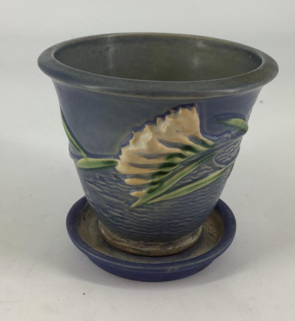 Roseville pottery 670-5” Freesia Delft Blue. Flower pot: Roseville pottery 670-5” Freesia Delft Blue. Flower pot with some water damage on bottom and saucer water damage also.
