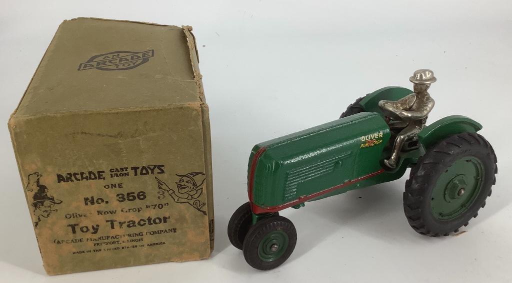 Cast iron tractor by Arcade Toy 7", with box, flap on (1 of 1)