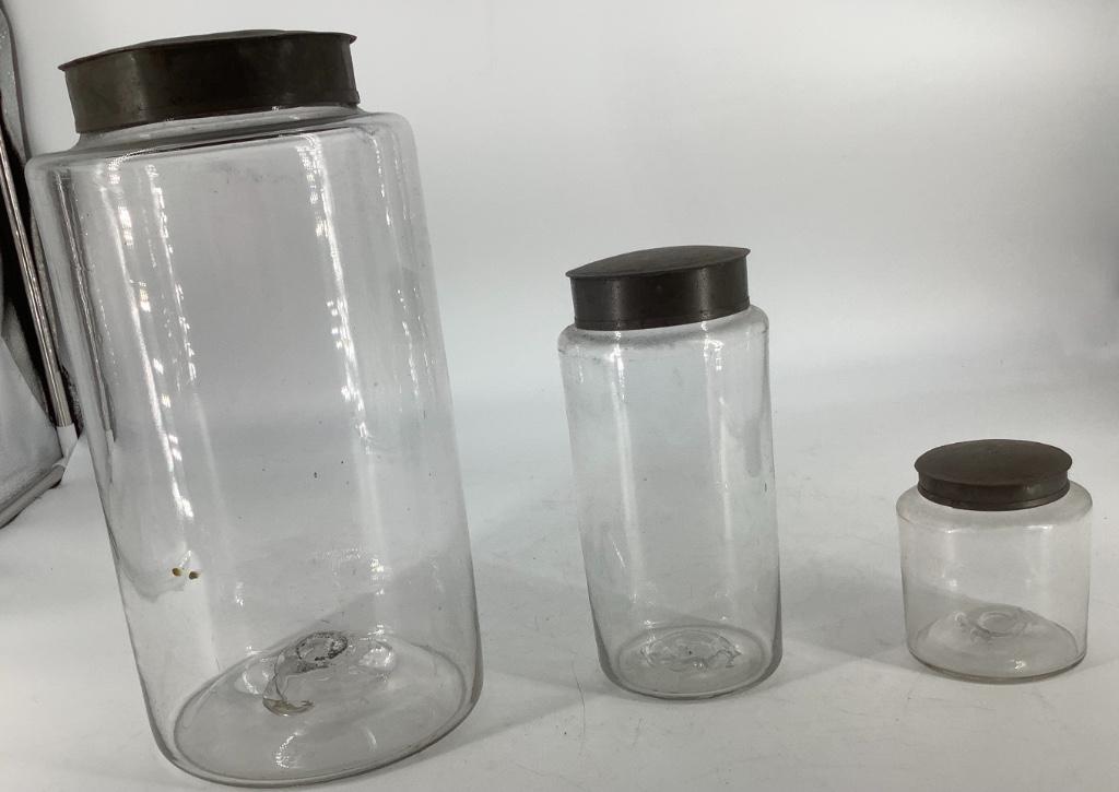 Three blown glass jars. 15” 8” and 4” with lids. (1 of 1)