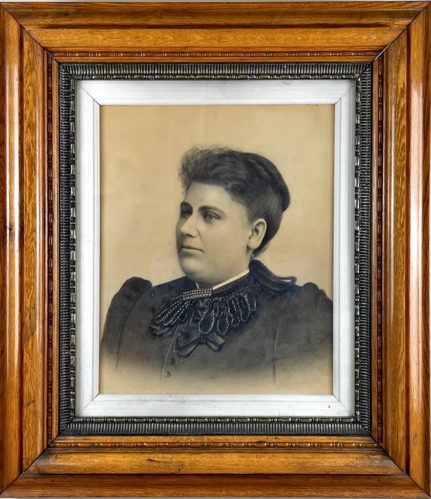 Framed portrait of Victorian woman in wide oak frame. (1 of 1)