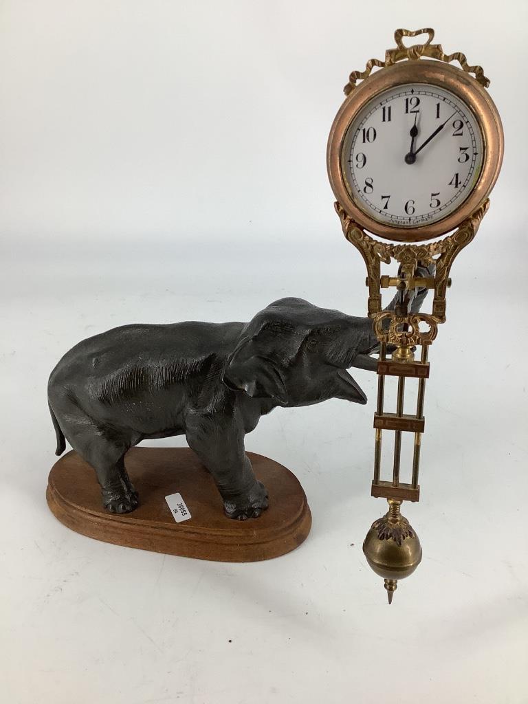 Swinging elephant clock. 11"H (1 of 2)
