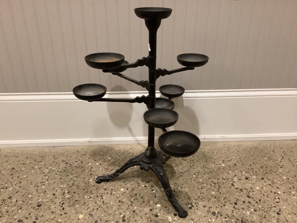 Cast iron plant stand with six arms.: Cast iron plant stand with six arms.