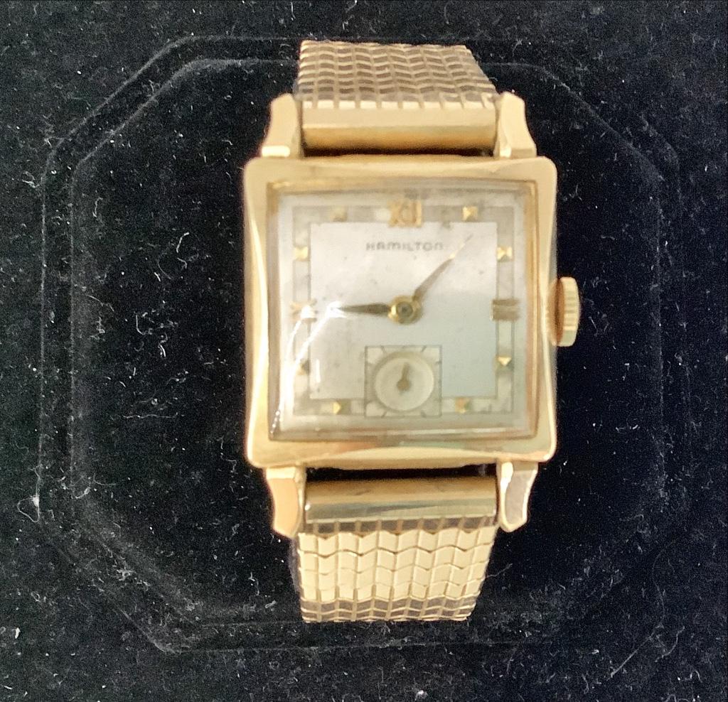 Vintage Hamilton Wrist Watch: Vintage Hamilton Wrist Watch Winds, sets and ticks at time of listing. Off-white face with tapered gold tone metal hands and roman numeral/bead indicators. Stretch band from Kreisler with gold-filled 