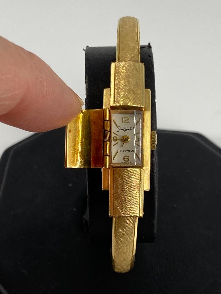Vintage Ladies Gold Filled Sheffield Wrist Watch: Vintage Ladies Gold Filled Sheffield Wrist Watch Hinged bangle style design featuring a florentine finish and hidden watch face, approx. 2” inner diameter (with extra room for larger wrists) set