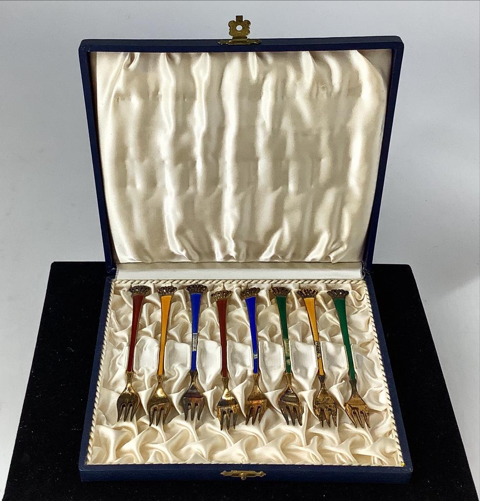 Sterling Silver Cocktail Forks: Sterling Silver Cocktail Forks Stamped and tested 925 with gilt finish, 4.75" in length, made in Denmark, signed Ela, in original box, set of eight guilloche enameled forks some with worn enamel and/o
