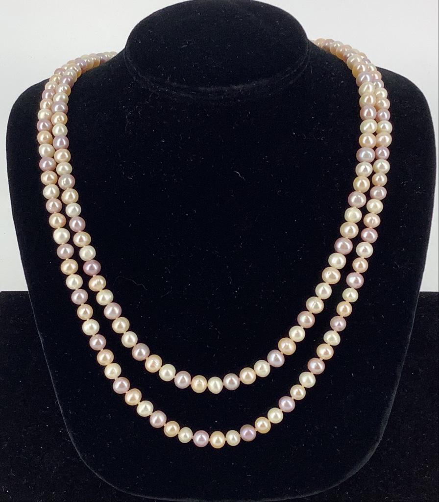 Pearl Strand Necklace: Pearl Strand Necklace 48" rope length strand of cultured pearls with off-white, champagne and pink body color. 6.5mm - 7.25mm in diameter. No clasp, unknown maker. 182-count.