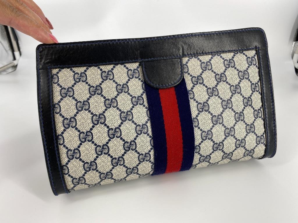 Vintage Gucci Cosmetic Bag: Vintage Gucci Cosmetic Bag Gently used condition, approx. 11” long, 3.5” wide & 7.5” deep, Italian made with velcro closure, water proof interior, classic double â€œG” exte
