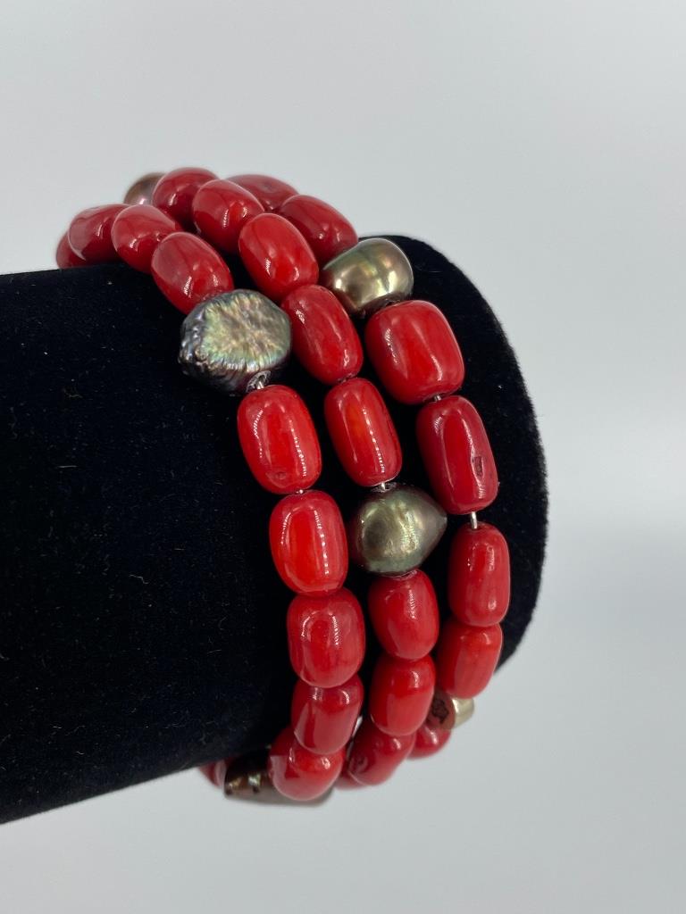 Coral & Pearl Bracelet: Coral & Pearl Bracelet Wrap around style bracelet featuring polished red coral beads accented by grey semi-baroque pearls (pearls feature good luster with moderate blemishes) ******* CORAL CAN ONLY BE