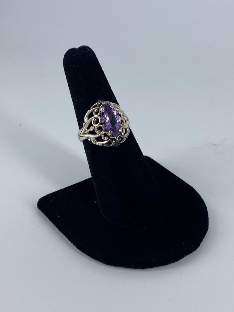 Sterling Silver Fashion Rings: Sterling Silver Fashion Rings Size 6.75, tapered shank ring featuring a marquise cut light purple center stones measuring approx. (12mm x 6mm) with an openwork romantic scroll like motif, stamped, tes