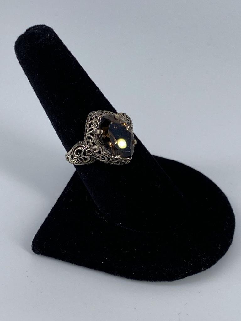 Sterling Silver Smokey & Smokey Quartz Ring: Sterling Silver Smokey & Smokey Quartz Ring Size 7.75, openwork tapered shank ring featuring an ornate openwork romantic design containing a smokey quartz center stone measuring (approx. 13.1mm x 8.5m