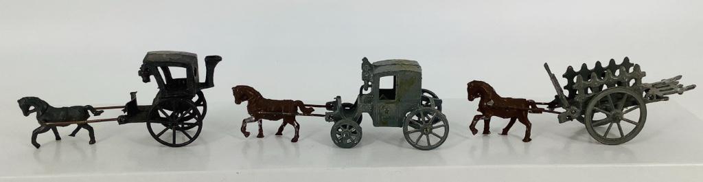 (3) Miniature metal horse and buggys/wagons. (1 of 1)