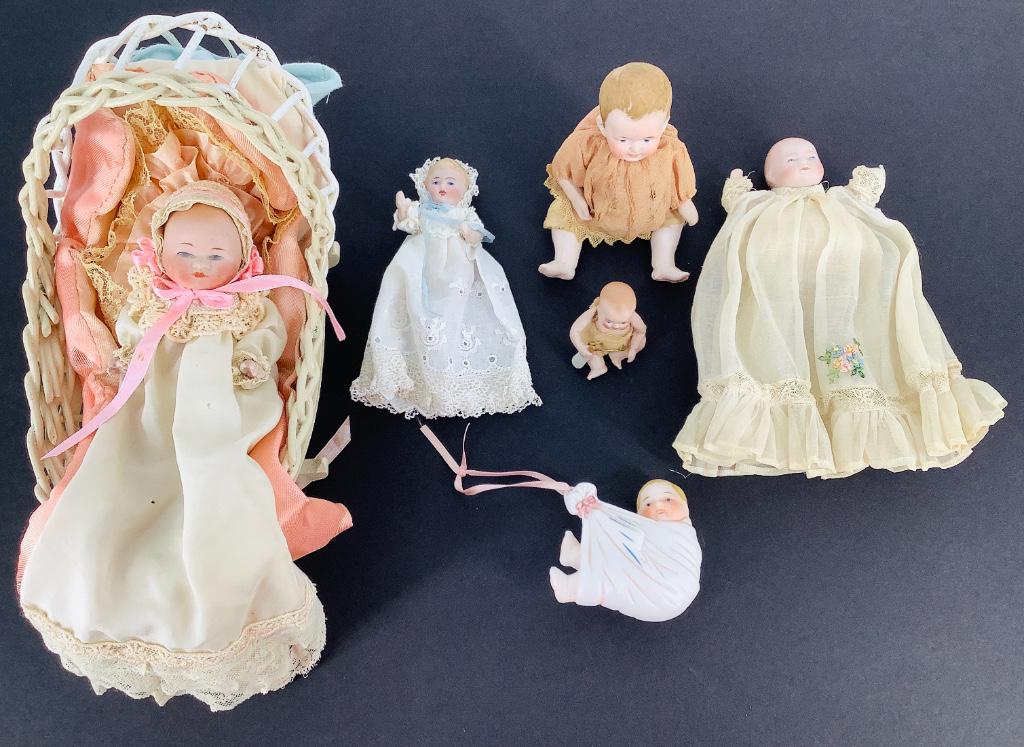 Lot (6) small bisque babies as shown. Includes 5 1/4" (1 of 1)